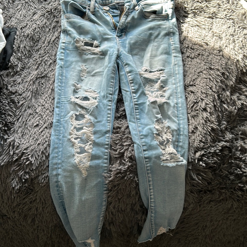 Light blue ripped jeans